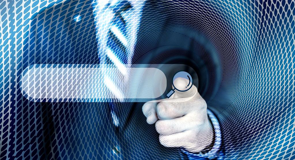 Modern workspace with multiple devices showing search interfaces